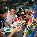 UOB employees and children from Very Special Arts and Little Arts Academy paint their interpretation of ‘My Singapore, My Home’ at the UOB Volunteers' Appreciation Event 2012.